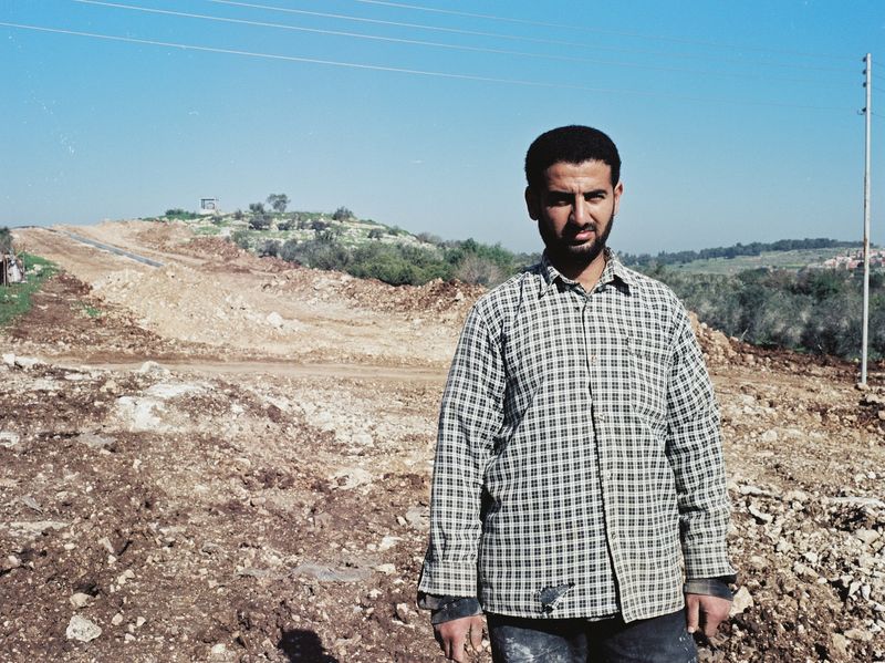 A gardener living outside Qalqilya. The wall will run through the community separating people from their agricultural land and from their families.

