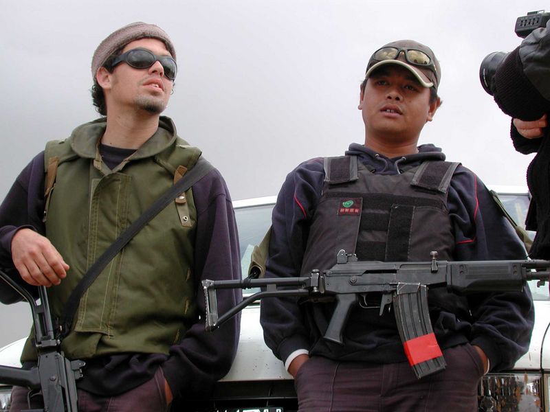 These young men are working for a private security company guarding the building of the wall. They say they took the job for the money, and that they think the wall is nessecary to protect Israel from terrorism. The one to the left said he'd rather be juggling on the beach and the one to the right that he is saving money to travel around the world.