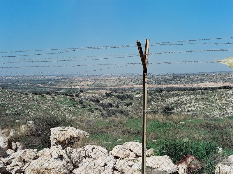 A security road inside the settlement Alfe Menashe. 
Qalqilya and Tulkarem at the horizon.