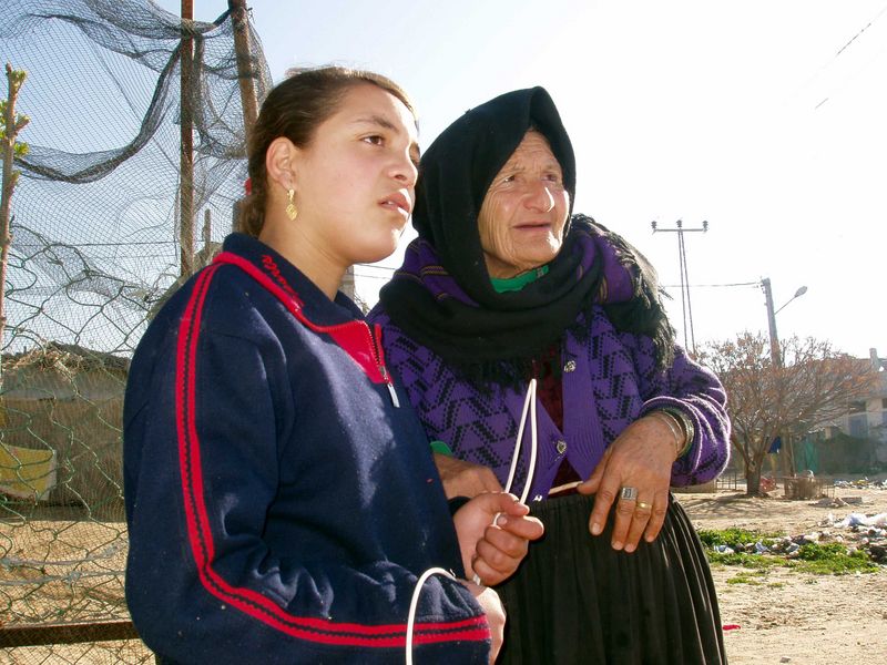 A woman and her granddaughter. Their house is now at the edge of the no mans land separating the Gaza Strip and Egypt. Three blocks have been erased so far.
