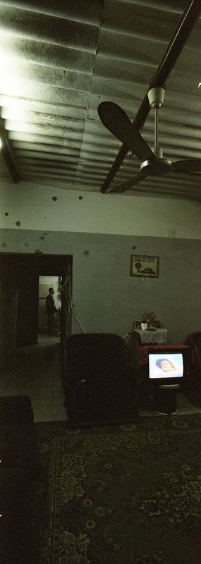 The bullets passed through the wall to the living room.