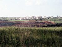 The wall encloses the village and separates it from its agricultural land.